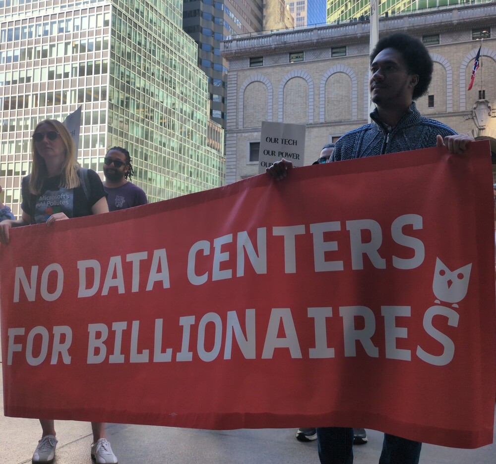 Protesters holding banner that says No Data Centers.